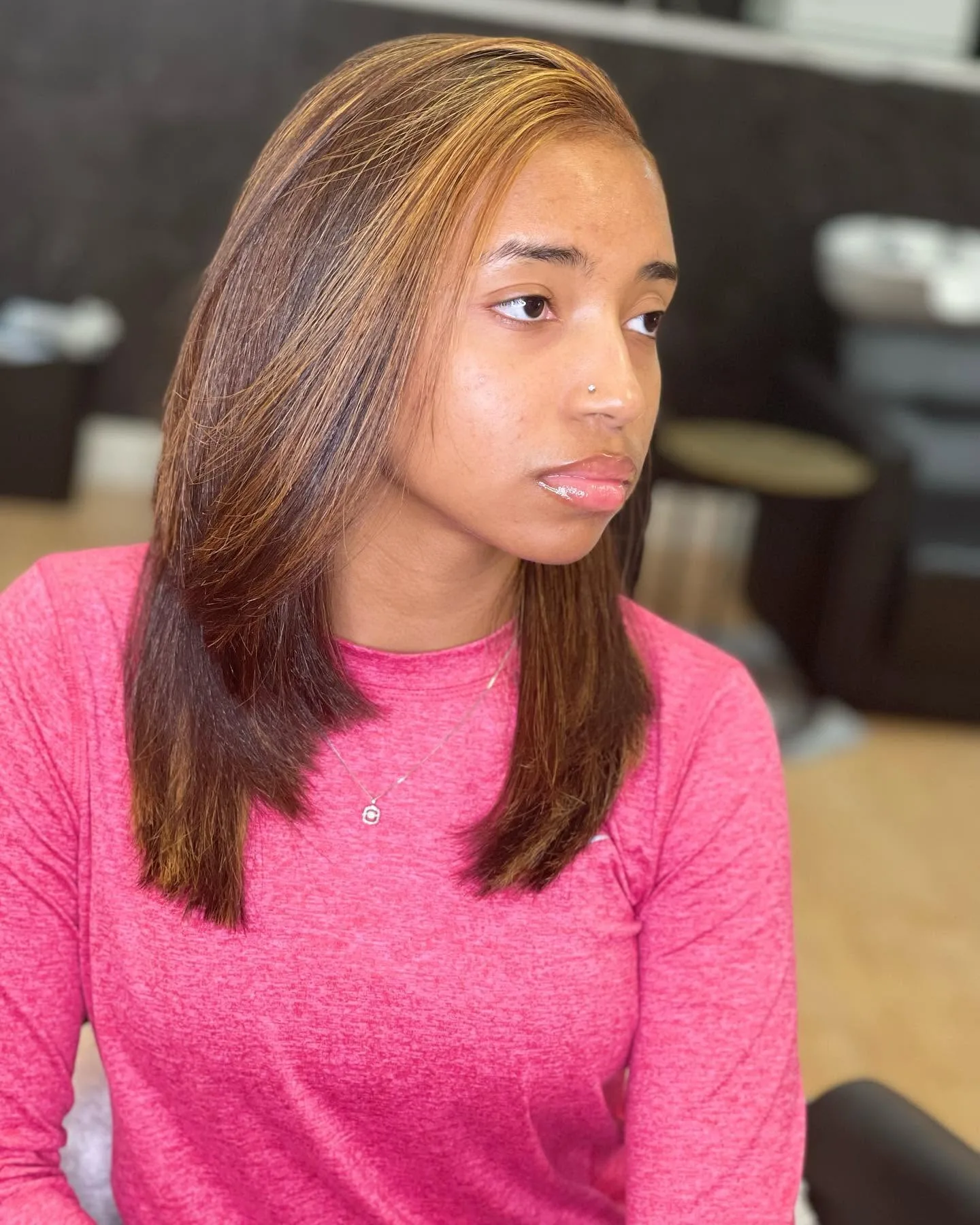 Finished hair color service and styled result.