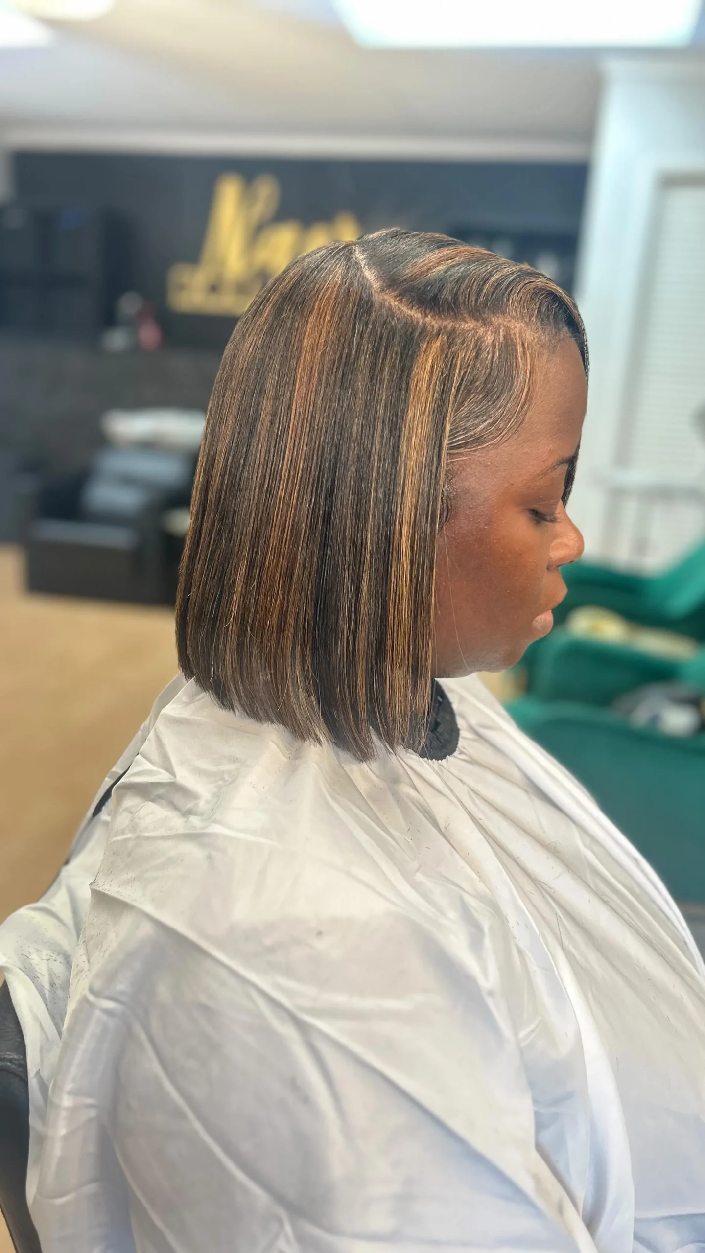 Finished hair color service and styled result.