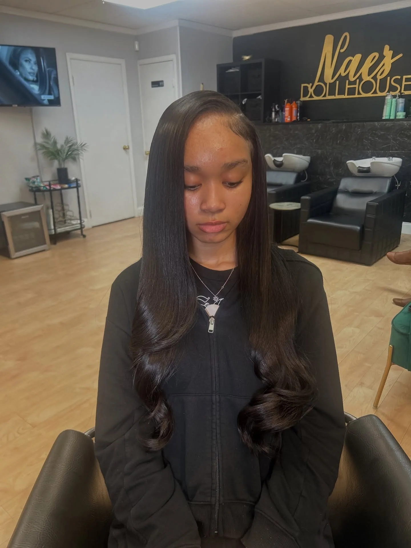 Finished sew-in hairstyle with a polished salon finish.